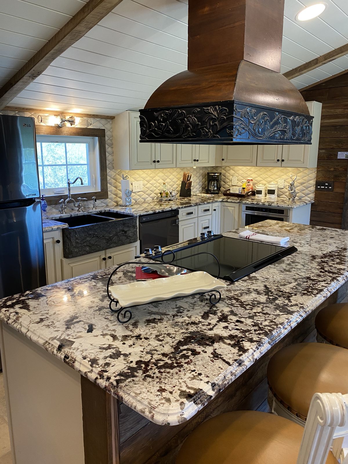 The Lavender Suite kitchen and its granite island