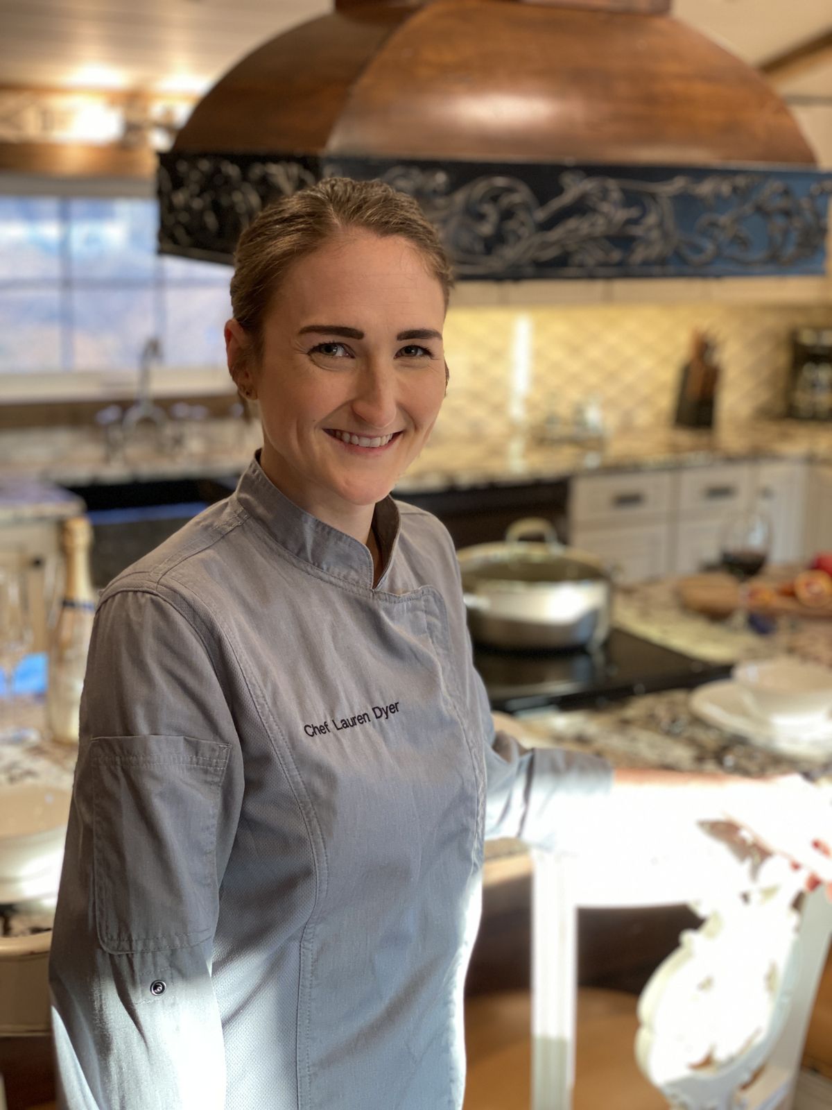 Chef Lauren Dyer smiling in the suite kitchen