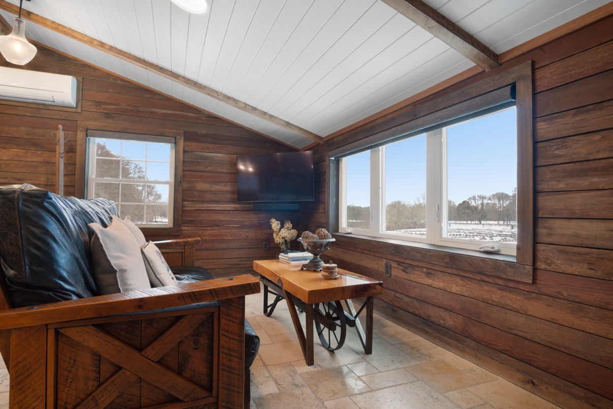 Inside the Farm Suite — the living room and its windows over the lavender field